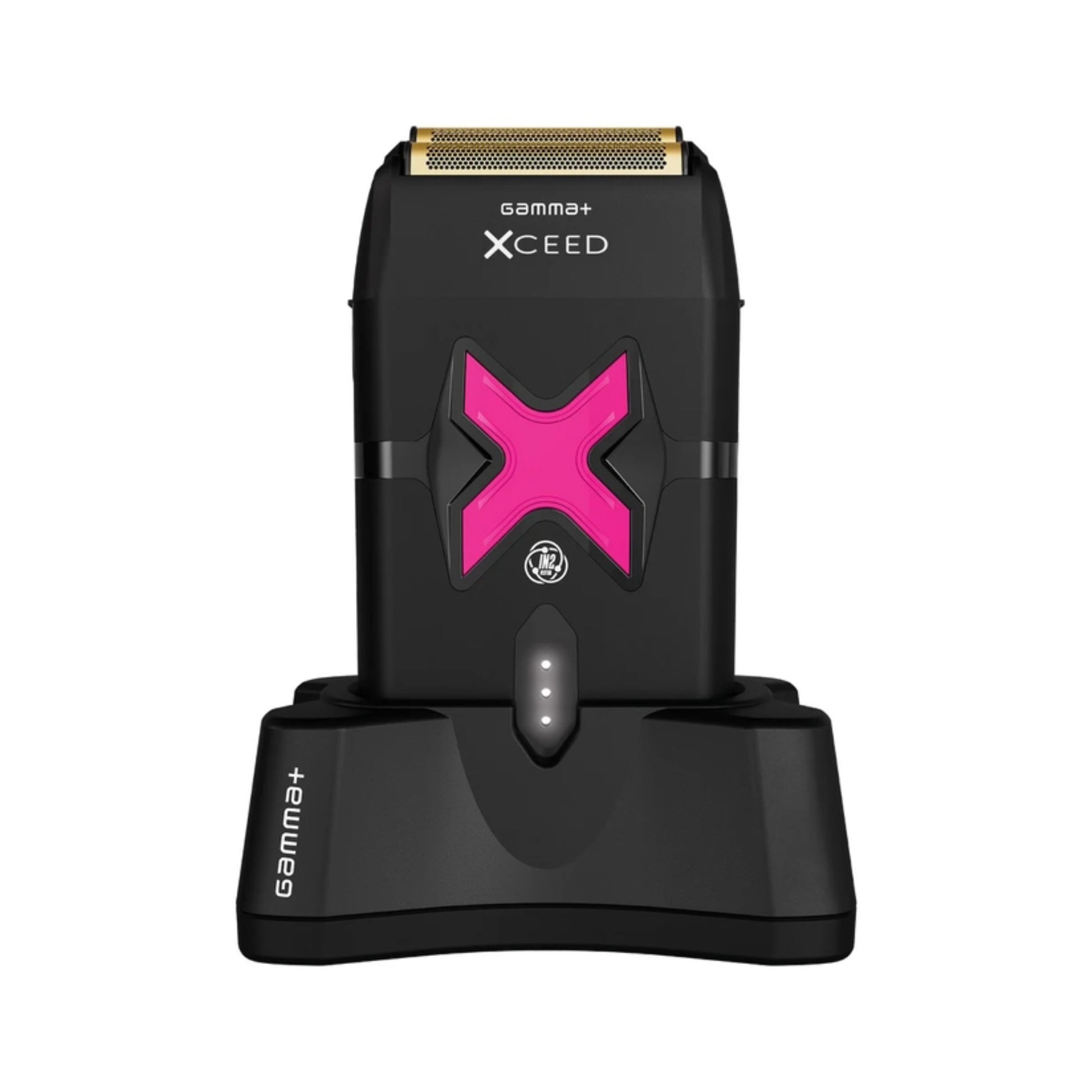 A black Xceed+ Gama+ electric shaver with a prominent pink 'X' logo, shown standing on its matching black charging dock against a solid white background.